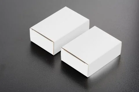 Two pillboxes packages on dark background mock-up series Stock Photos
