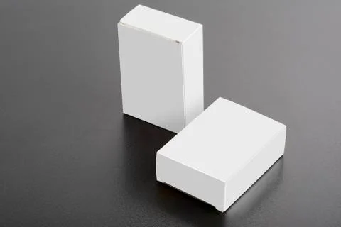 Two pillboxes packages on dark background mock-up series Stock Photos