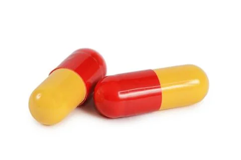 Two pills isolated on white background Stock Photos