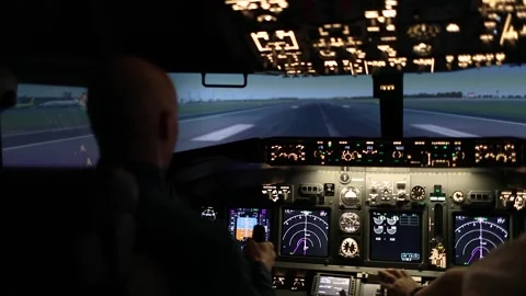 Two pilots are preparing to take off and control the aircraft in the dark. The Stock Footage 241818864