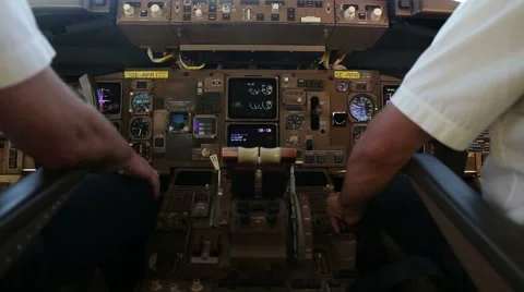 Two pilots in the cockpit of a passanger airplane Stock Footage