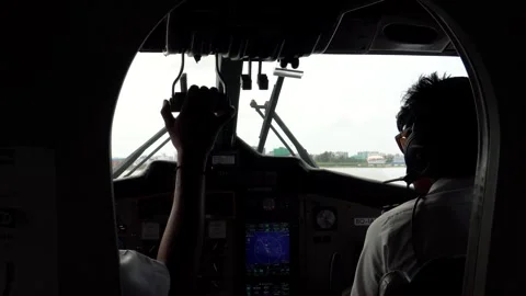 The two pilots control the seaplane. The cabin Video stock 282950913