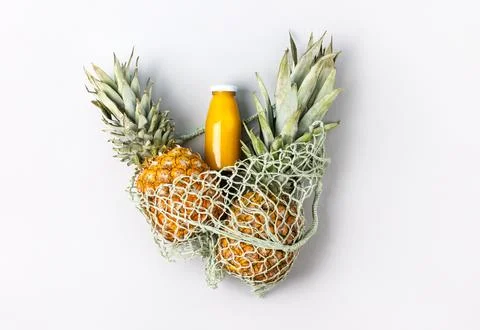 Two pineapples and juice Stock Photos