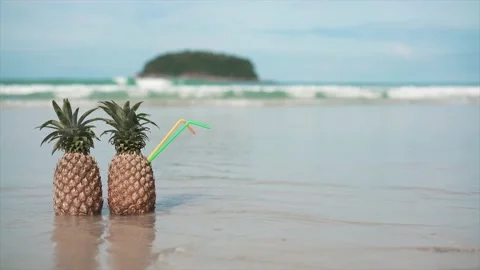 Two Pineapples on the beach Video stock 139753894