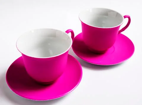 Two pink ceramic Cup on white background Stock Photos