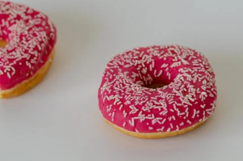 Two pink donut on white  background. Stock Photos