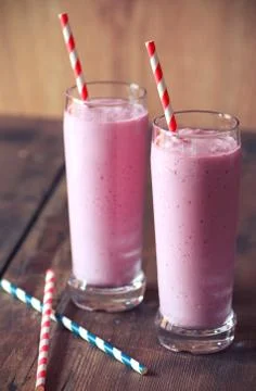 Two pink smoothies Stock Photos