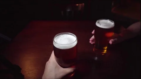 Two Pints Beer Point Of View POV Toast Two Men Drinking Pub Bar Night Alcohol Stock Footage