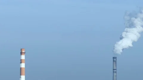 Two pipes, one of them with white smoke. Stock Footage 71096478