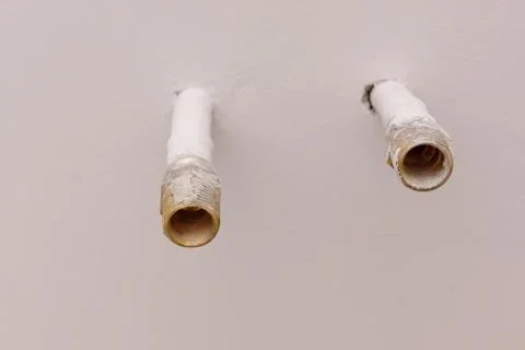 Two pipes in wall Stock Photos