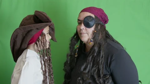 Two pirates decide not to fight. Shaking head than hugging and tapping each Stock Footage 258809530