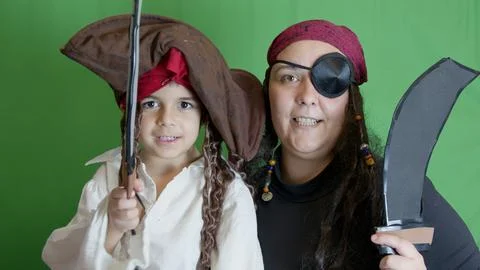 Two pirates decide not to fight hugging and tapping each other on the shoulder. Stock Photos
