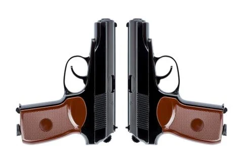 Two pistols symmetrically directed down the trunks Stock Photos