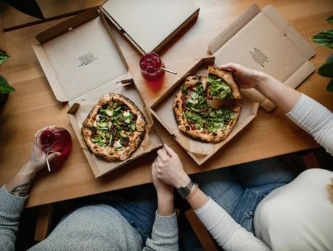Two pizzas in boxes on a table with lemonade, romantic Stock Photos