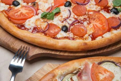 Two pizzas on the table Stock Photos