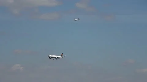 Two planes approaching Frankfurt airport Stock Footage