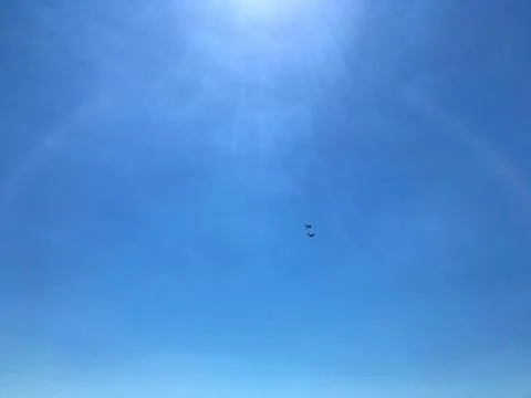Two planes in the blue sky. Stock Photos