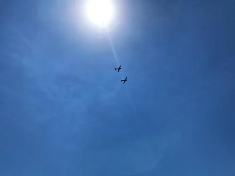 Two planes in the blue sky. Stock Photos