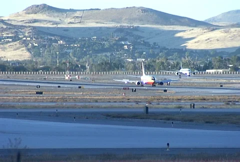 Two Planes one Taking off from Reno Daytime Stock Footage 97775940