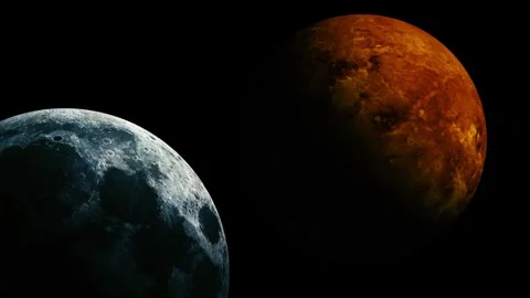 Two planets in dark space, one gray cratered world in the foreground and on.. Video stock 340382949