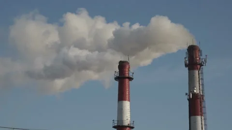 Two Plant Pipes With Smoke Against Blue Sky Stock Footage 59606807