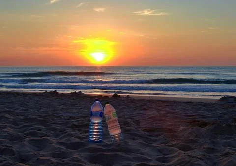 Two plastic bottles on a beach Stock Photos
