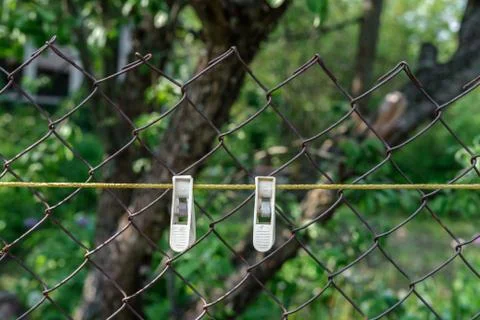 Two plastic clothespins. Stock Photos