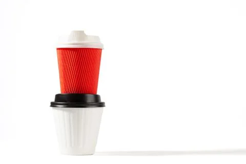 Two plastic coffee cups stacked on top of each other isolated on white with c Stock Photos