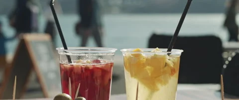 Two plastic glasses of cocktails Stock Footage 152583151