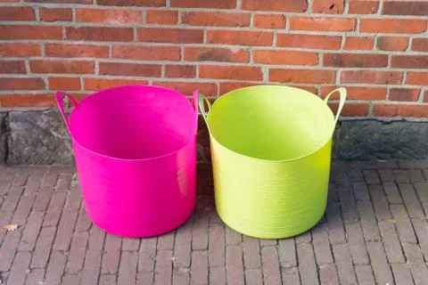 Two plastic laundry baskets Stock Photos