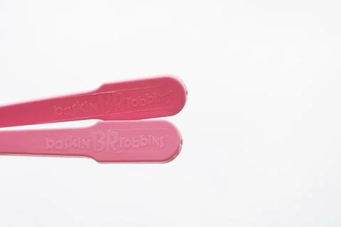 Two plastic spoons on isolated white background Foto stock