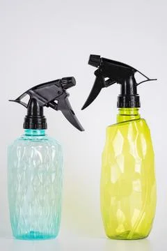 Two plastic spray bottles on light background Stock Photos