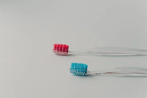 Two plastic toothbrushes for hygiene cavity mouth with lateral side isolated  Stock Photos