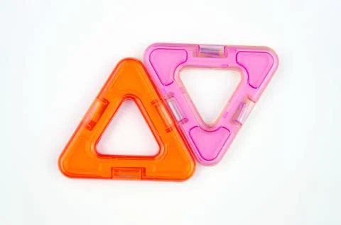 Two plastic triangles from transparent magnet constructor kit (puzzle builder) Stock Photos