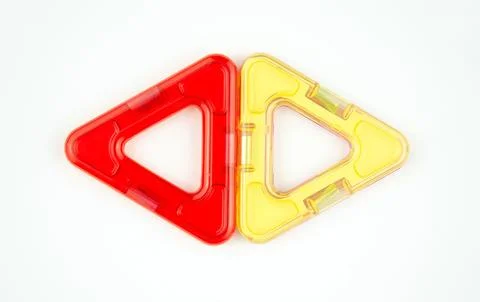 Two plastic triangles from transparent magnet constructor kit (puzzle builder) Stock Photos