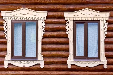 Two plastic windows under the tree in the wall of the frame Stock Photos