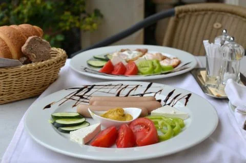 Two plates with colorful breakfast Stock Photos