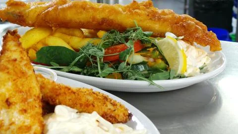 Two Plates of Fish &amp; Chips - Battered and Breaded Haddock Stock Photos