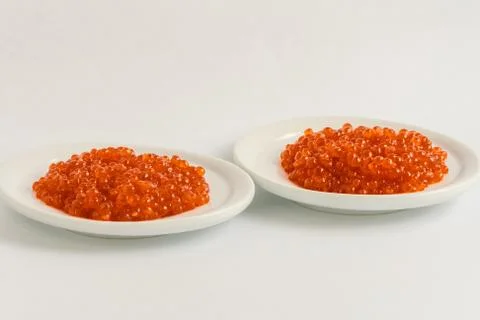 Two plates of red caviar Foto stock