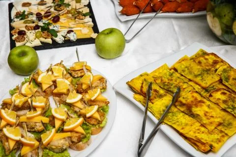Two plates with snacks on a buffet table. Selection of tasty bruschetta or ca Stock Photos