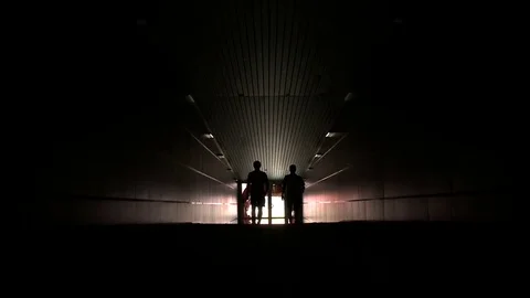 Two players go out from under the stands of the stadium Stock Footage 78569532