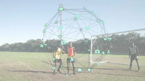 Two players lunging defending goal as incoming ball initiating training node Video stock 333526200