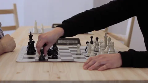 Two players play chess intensely and quickly, taking a lot of pieces Stock Footage 205318892