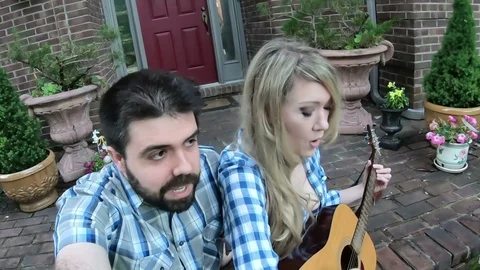 Two playing guitar outside Video stock 108209519