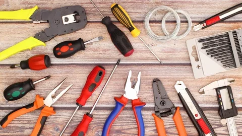 Two pliers appear on table with construction tools - Do it yourself stop motion 스톡 동영상 124818957
