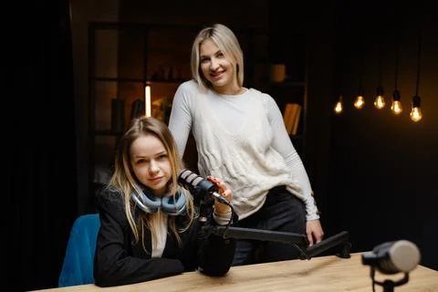 Two podcasters gesturing ok sign during a live recording Stock Photos