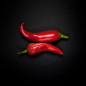 Two pods of red pepper Stock Photos