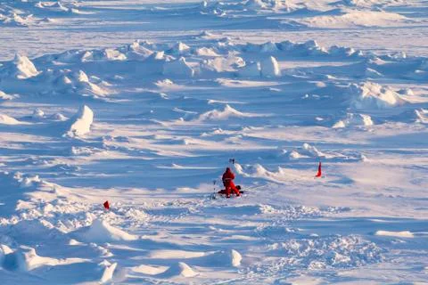Two polar scientists working on an ice floe Stock Photos
