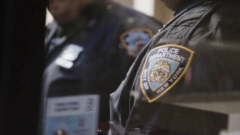 Two police officials talking Stock Footage 71557034