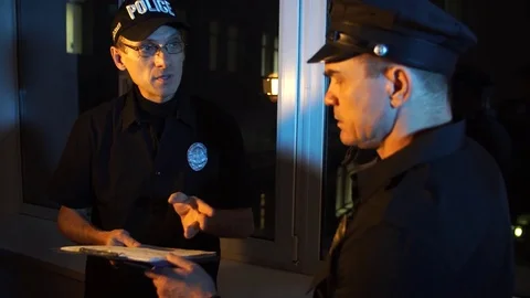 Two police us communicate Stock Footage 69880483